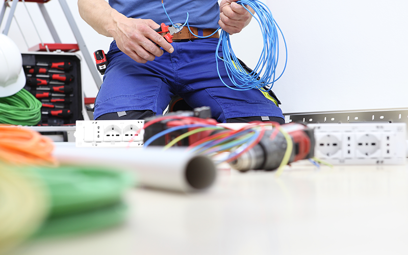 an electrician starting a rewiring project